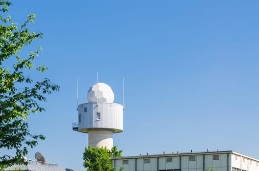 Meteorological measuring station with white dome/weather station.