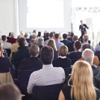 Speaker Giving a Talk at Business Meeting. Audience in the conference hall. Business and Entrepreneurship.