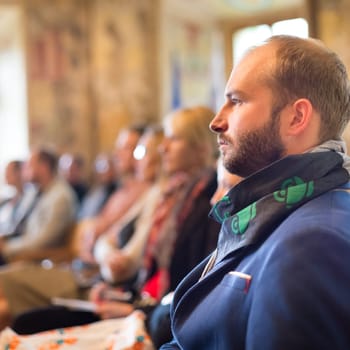 Presentation at Business Conference. Entrepreneurs in the audience at the conference hall.