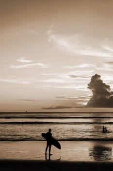Emotion of relax, Silhouette people relax on the beach, Sepia tone