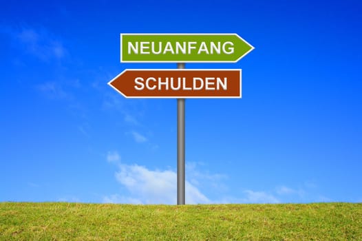Signpost on a meadow in front of blue sky shows debt new beginning