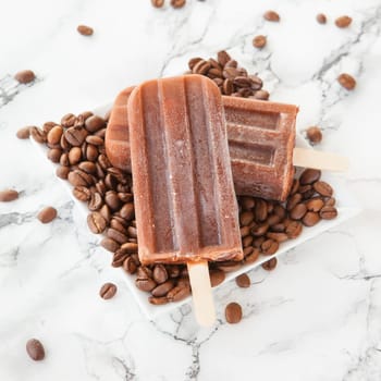 Frozen coffee on the stem with coffee beans