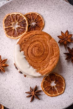 Round sweet New York roll croissant with pistachio cream filling on a dark concrete background