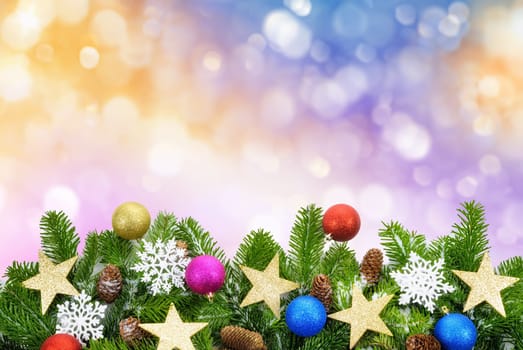 Studio recording of ornate fir branches on defocused colorful lights