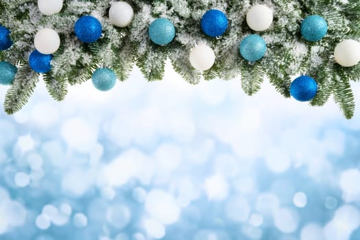 Winter or Christmas background of fir branches,Christmas balls and fuzzy lights