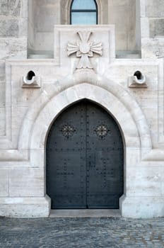 Detailed view of a medieval cathedral door.