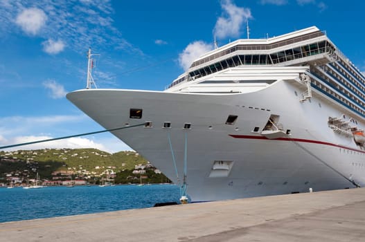 Cruise ship docked at a port in the Caribbean Sea.
