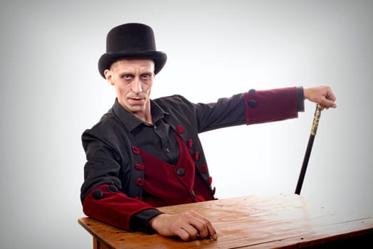 Man dressed up as Dracula for the halloween with black hat