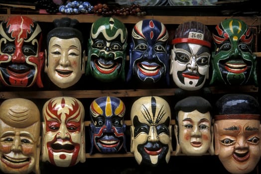 masks in a market in the town of Yangshou near the city of Guilin in the Province of Guangxi in china in east asia.