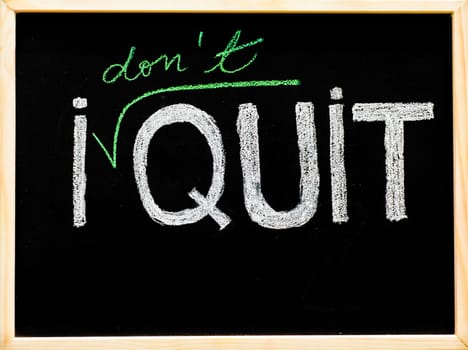 I don't quit message, handwriting with chalk on wooden frame blackboard, lifestyle change concept