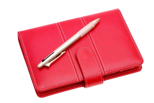 leather notebook and ballpoint pen isolated on a white background