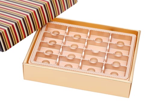 Empty box from sweets of gold color on white background