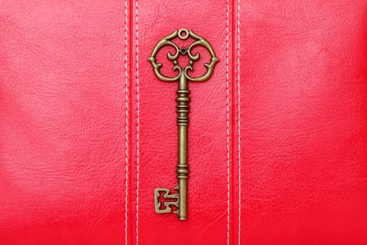 antique door key on a leather background