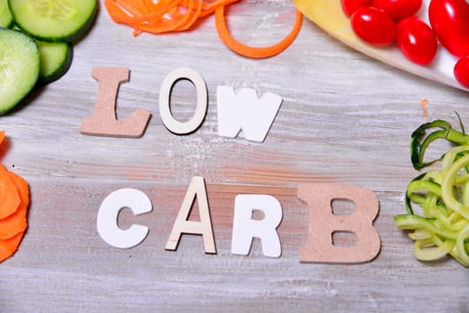 Low Carb Vegetable Letters Text Wooden Background