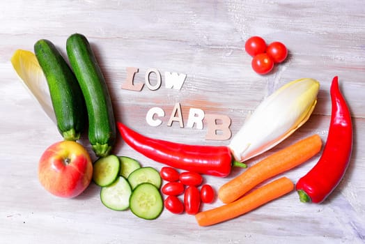 Low Carb Vegetable Letters Text Wooden Background