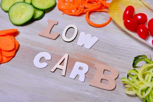 Low Carb Vegetable Letters Text Wooden Background