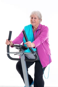 gray-haired female senior train with fitness machine