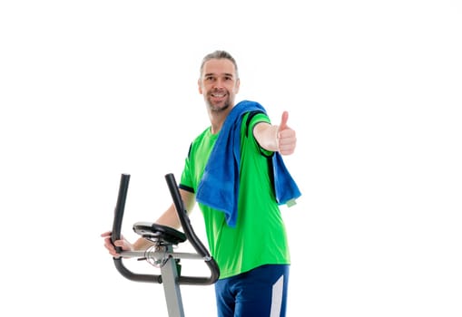 young man with thumb up train with fitness machine