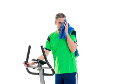 young man in green shirt train with fitness machine