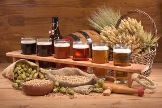 Beer carriers and beer glasses with wheat,barley,hops and malt