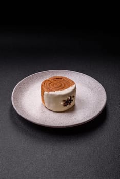 Round sweet New York roll croissant with pistachio cream filling on a dark concrete background