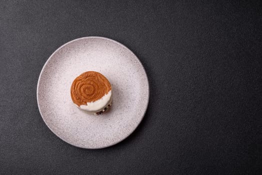 Round sweet New York roll croissant with pistachio cream filling on a dark concrete background