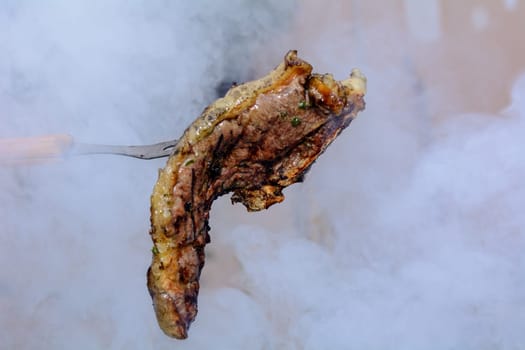Roast beef, cooked in the outdoor barbecue in a rural location. Sauce