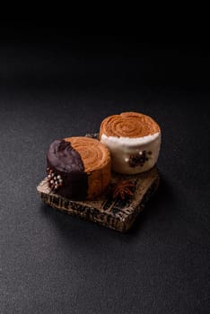 Round sweet New York roll croissant with chocolate cream filling on a dark concrete background
