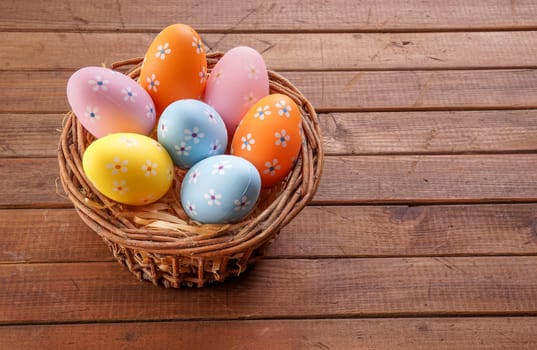 Colorful Easter eggs gathered in a basket