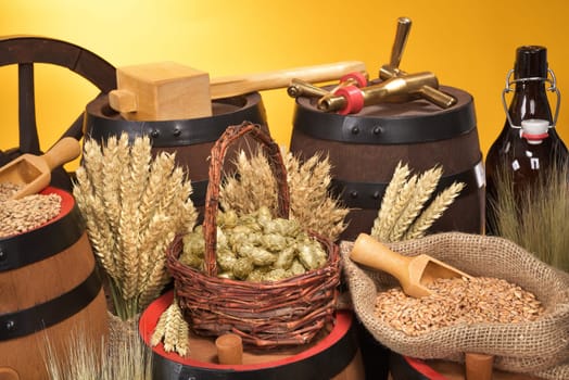 Beer barrels,beer bottle,hammer and tap with wheat,barley,hops and malt