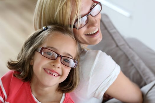 Mother and daughter with eyeglasses on