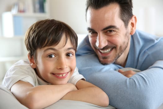 Portrait of father and son relaxing at home