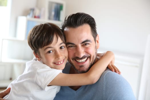 Portrait of father and son relaxing at home