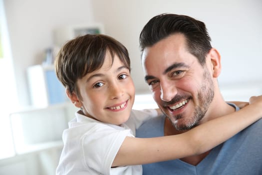 Portrait of father and son relaxing at home