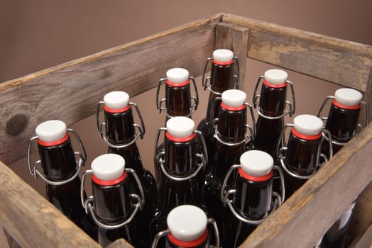 Close-up of many beer bottles with ironing closure in old beer box