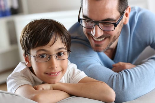 Portrait of young boy with daddy with eyeglasses on