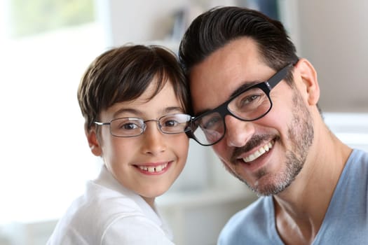 Portrait of young boy with daddy with eyeglasses on