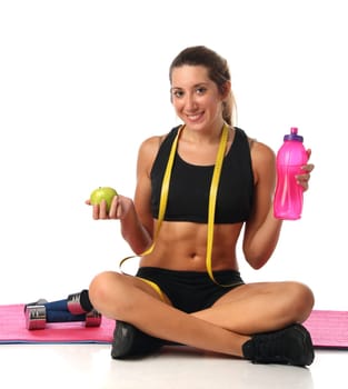Happy young woman with her fitness equipment over white