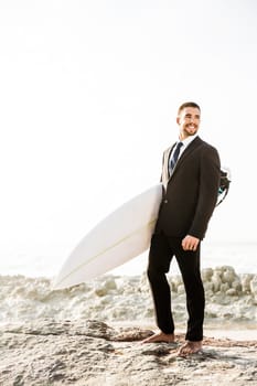 A Businessman holding is surfboard after a long day of work