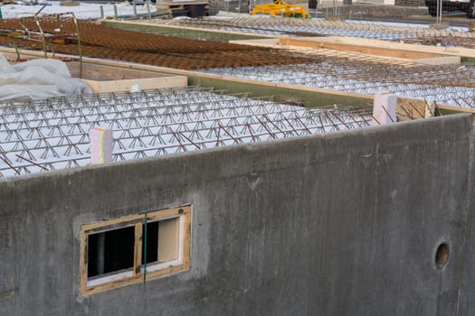 Construction site,shell and foundation with excavation pit of a basement floor.
