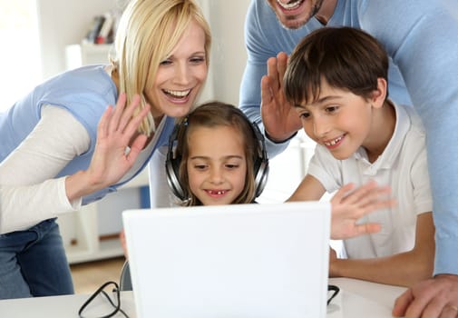 Family using webcamera to communicate with loved ones
