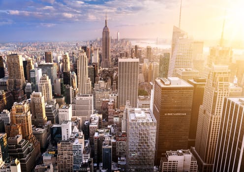 New York City skyline with urban skyscrapers at sunset, USA.
