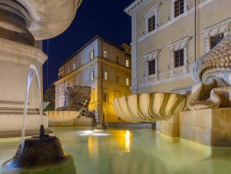 a night in trastevere, part of the fountain in santa Maria in Trastevere square