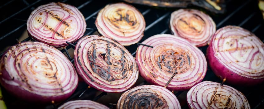 Grilling fresh and tasty Onions on barbecue