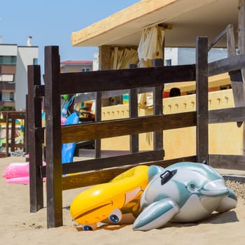 different toys on a beach in italy near Rome