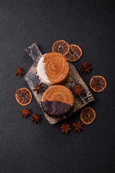 Round sweet New York roll croissant with chocolate cream filling on a dark concrete background
