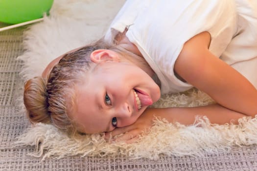 Photo of cute playing girl with blond hair