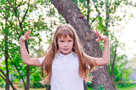 Photo of girl playing with long hair