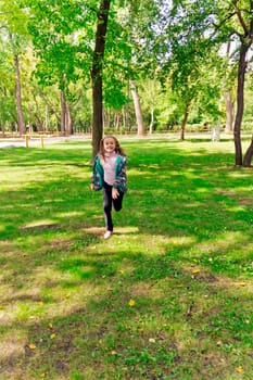 Photo of cute running girl in summer