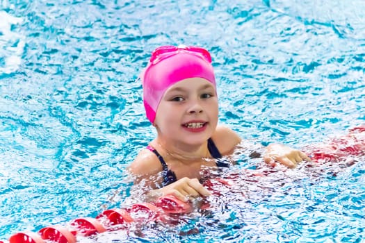 Photo of cute girl in swimming pool
